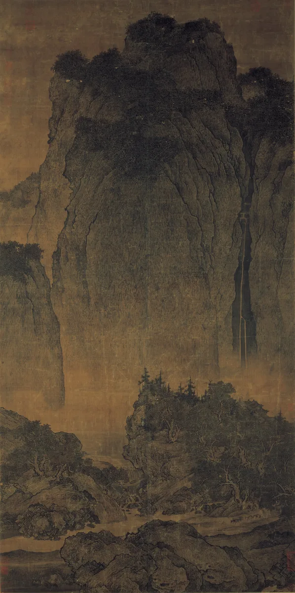 Fan Kuan, Travelers Among Mountains and Streams, around 1000: a huge dark mountain filling the top of the scroll, a thin waterfall, and tiny travelers with mules at the bottom.